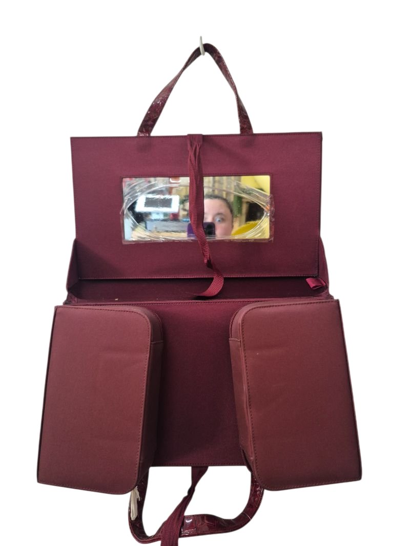 Este Lauder Dual Pocket Handbags